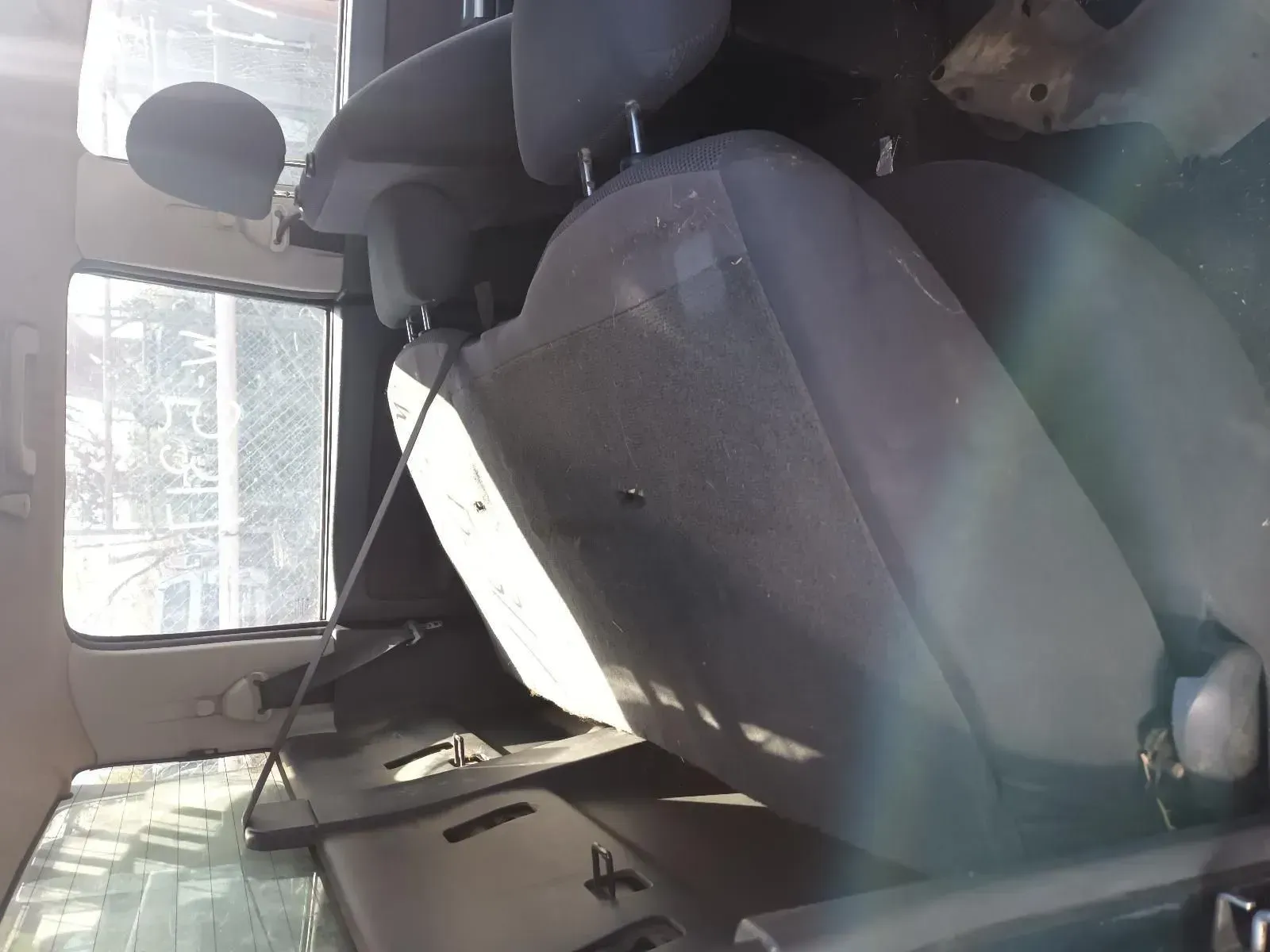 Inside of a Gray Car Interior, View of the Driver's Seat, Headrest, and a Window — South West 4WD Wreckers In Brisbane, QLD