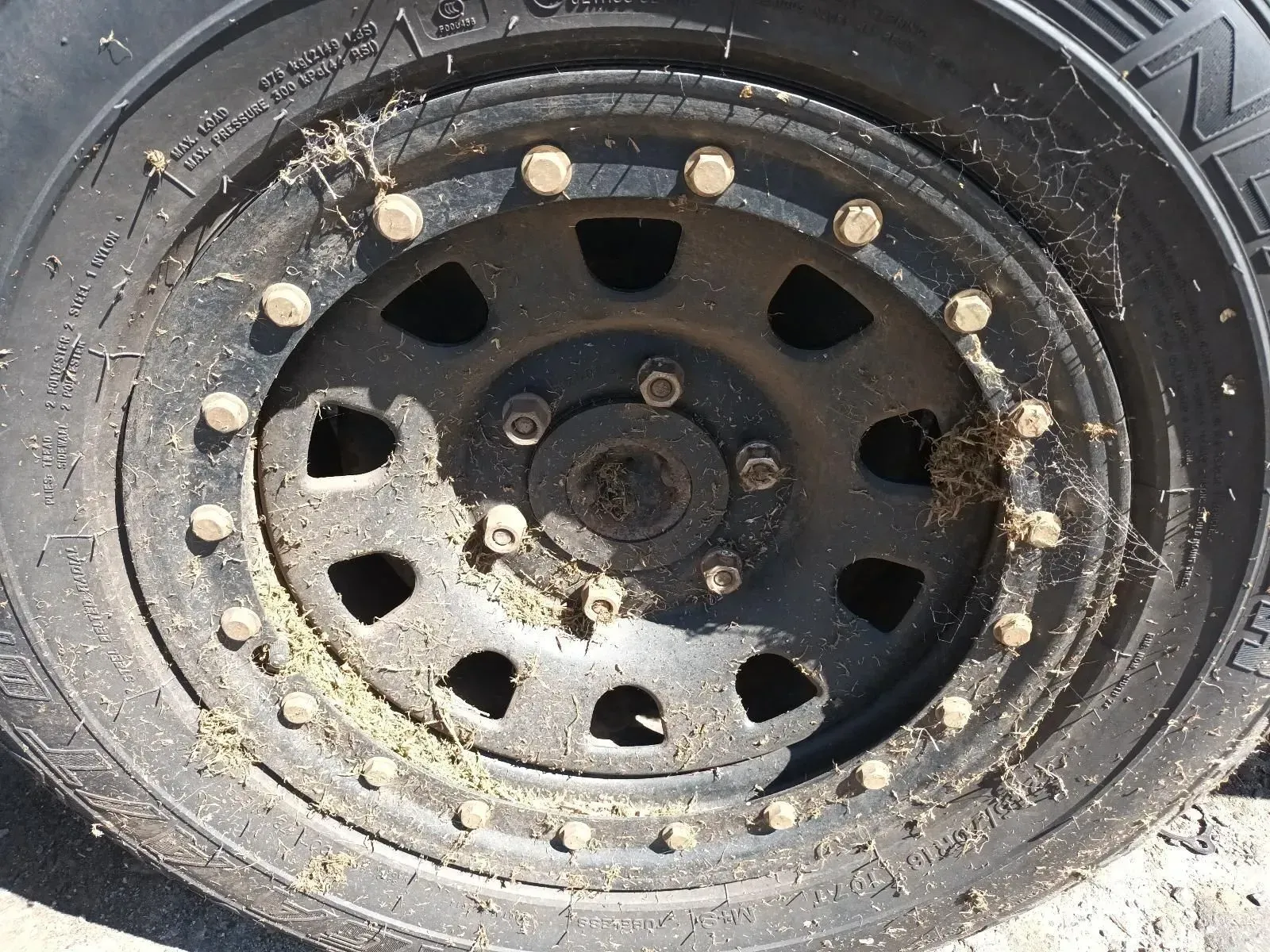 Black Off-road Vehicle Wheel Covered in Mud and Debris — South West 4WD Wreckers In Brisbane, QLD