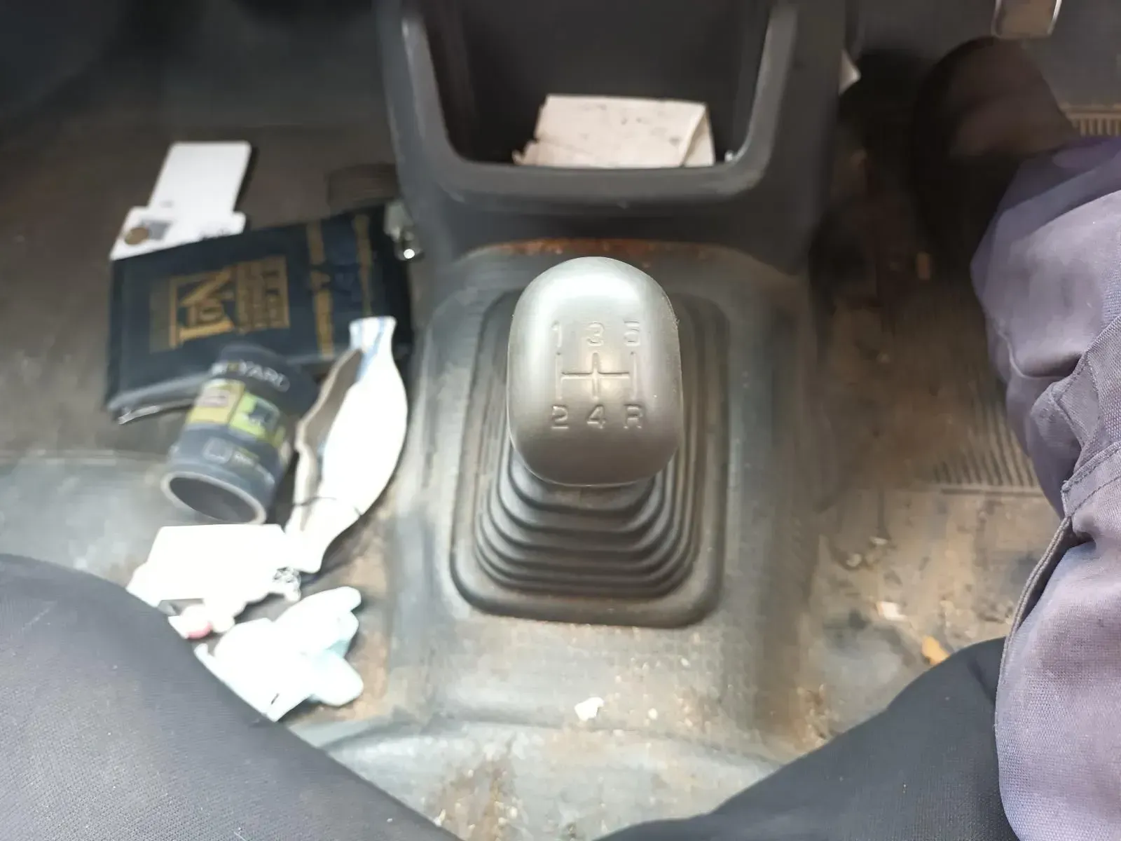 Manual Gear Stick in a Dirty Vehicle Interior, With Personal Items — South West 4WD Wreckers In Brisbane, QLD