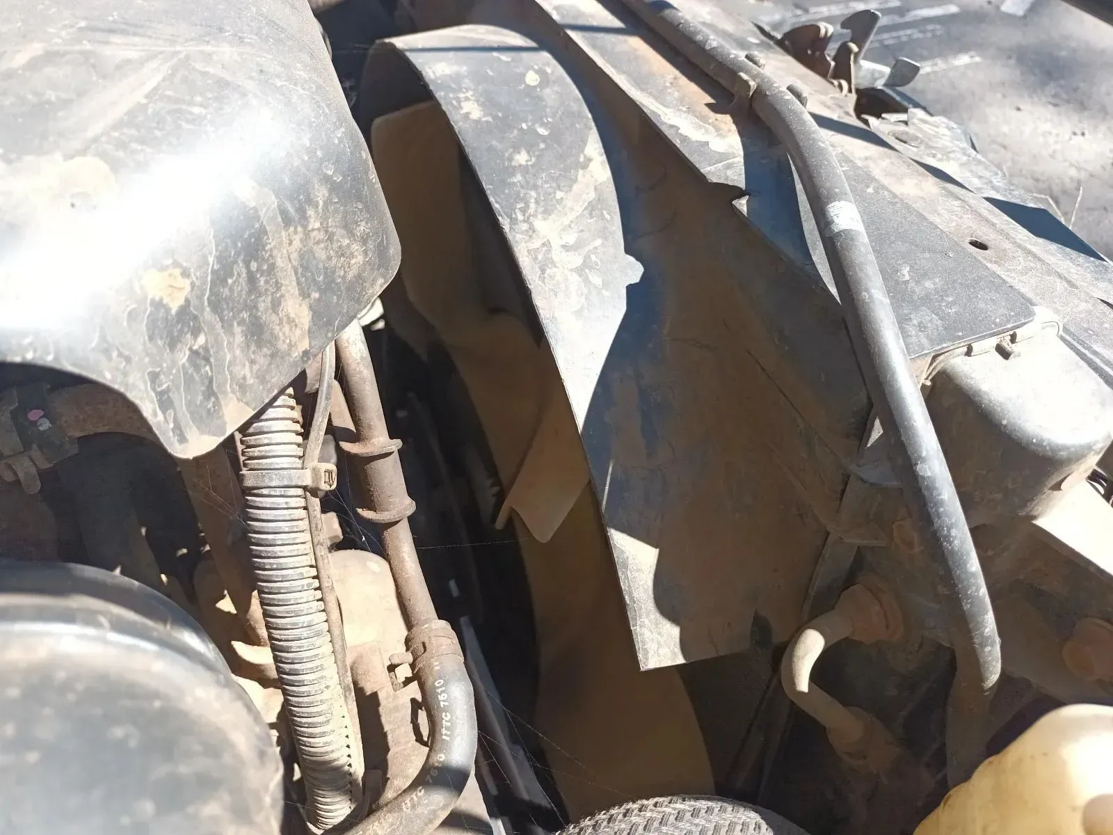 Black Fan Blades Inside a Vehicle Engine Compartment — South West 4WD Wreckers In Brisbane, QLD