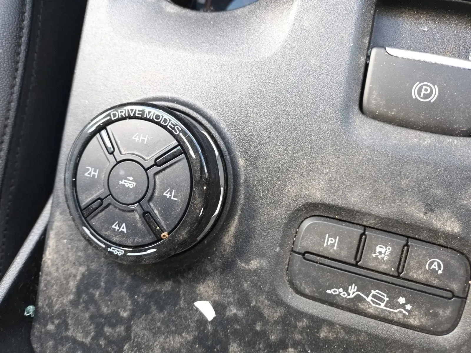 Black 4-wheel Drive Dial and Controls in a Dusty Vehicle Console — South West 4WD Wreckers In Brisbane, QLD