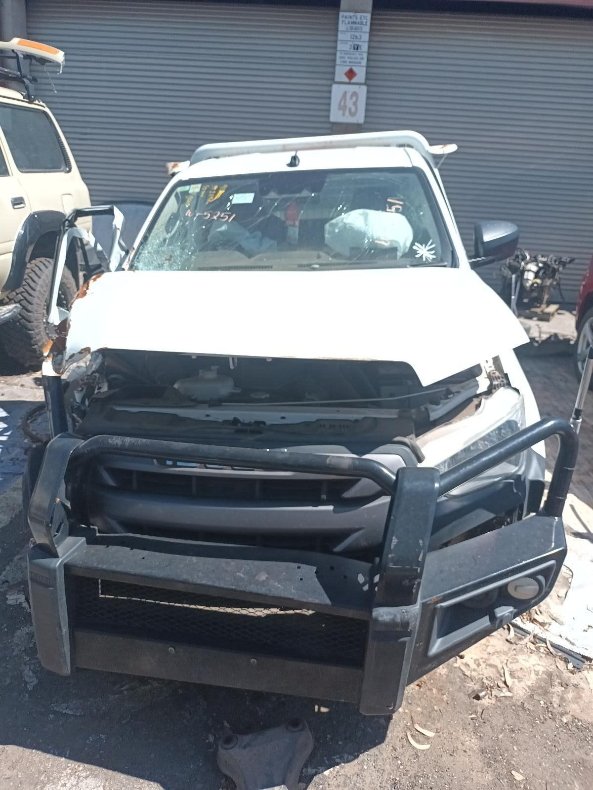 A White Truck With a Black Bumper is on the Ground — South West 4WD Wreckers In Brisbane, QLD