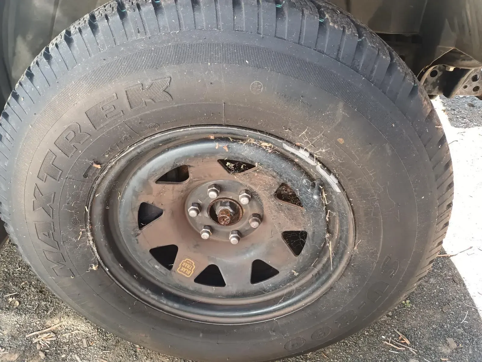 Black Tyre on a Black Steel Rim, Mounted on a Car — South West 4WD Wreckers In Brisbane, QLD
