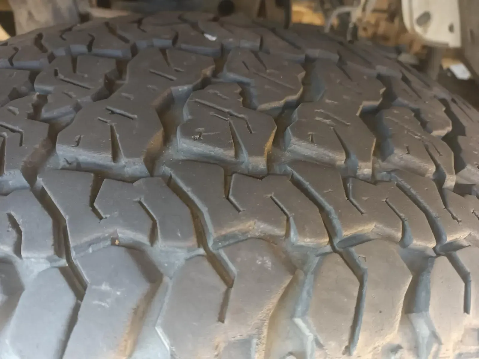 Close-up of a Used Black Tyre With an Aggressive Tread Pattern — South West 4WD Wreckers In Brisbane, QLD