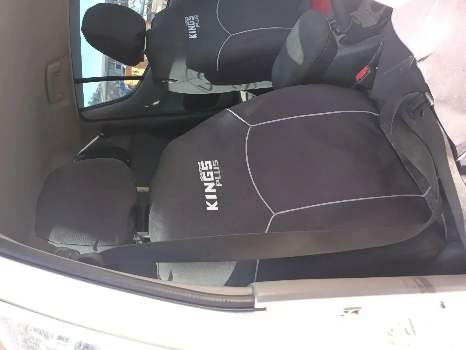 Black Car Seat Covers With White Stitching in a Car — South West 4WD Wreckers In Brisbane, QLD