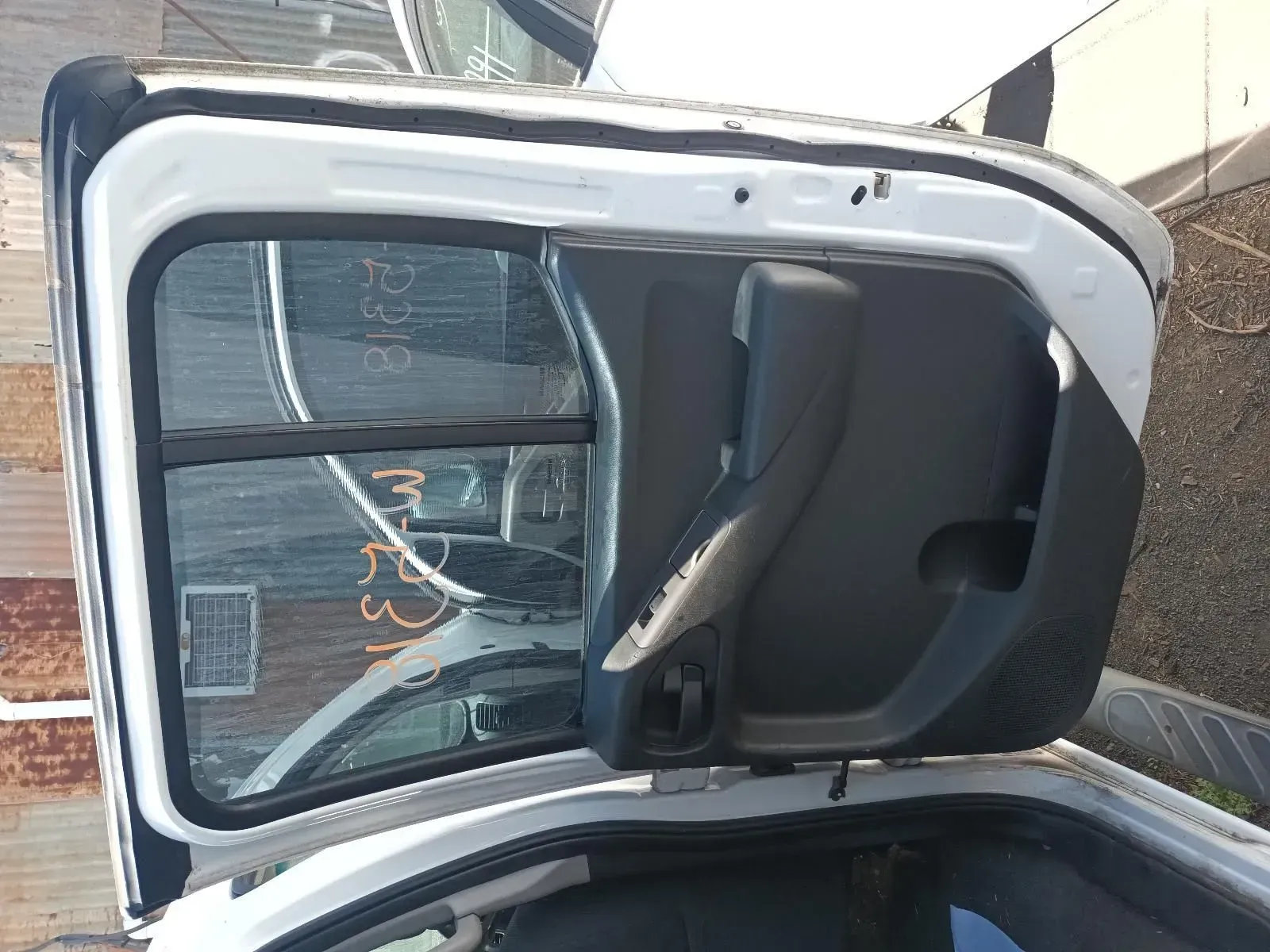 White Car Door, Black Handle, and Window, Viewed From an Angle, Outdoors — South West 4WD Wreckers In Brisbane, QLD