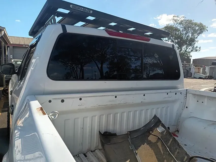 The Back of a White Truck with a Roof Rack on Top of It — South West 4WD Wreckers In Brisbane, QLD