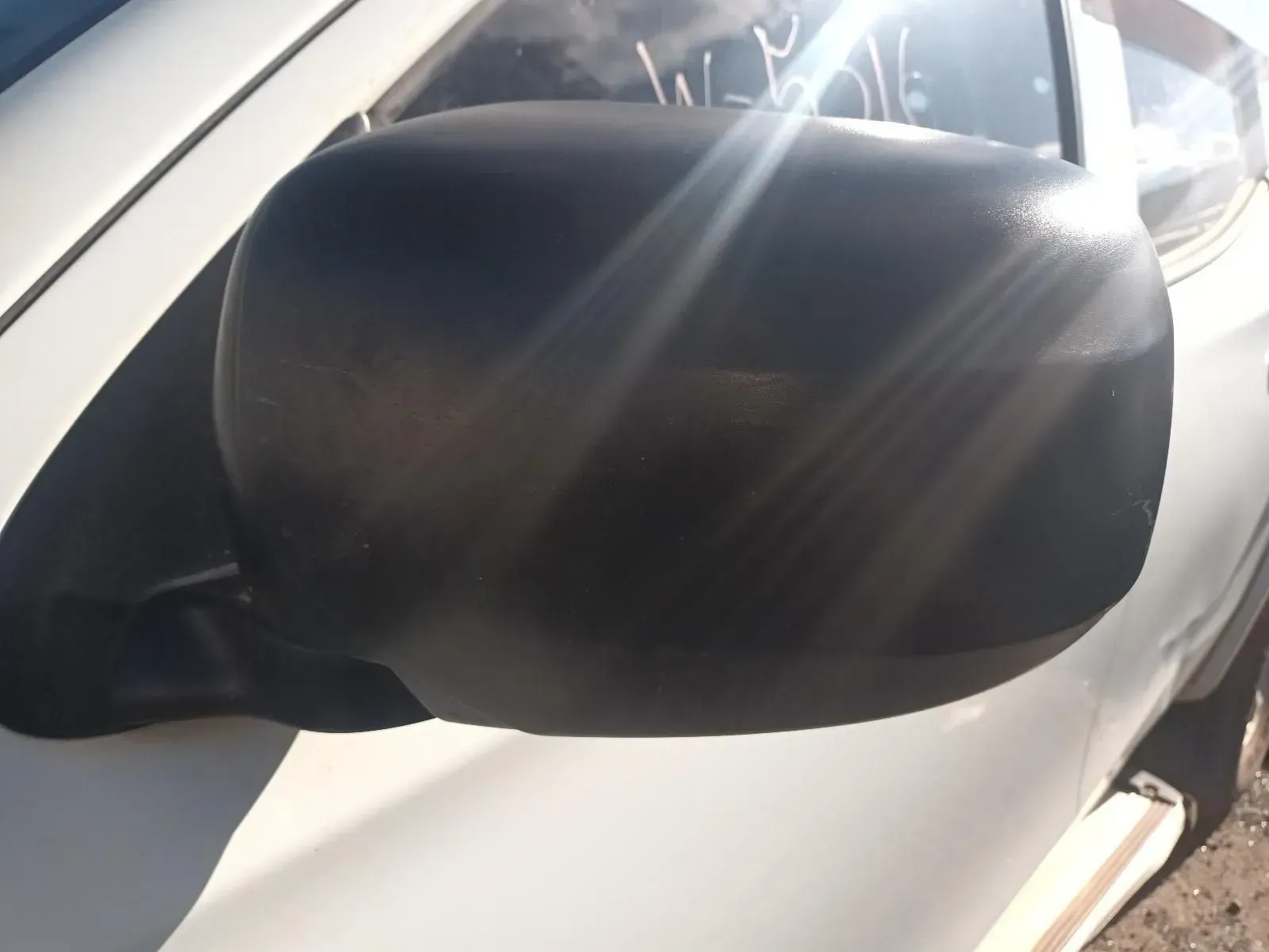 Black Side View Mirror on a White Car, Reflecting Sunlight — South West 4WD Wreckers In Brisbane, QLD