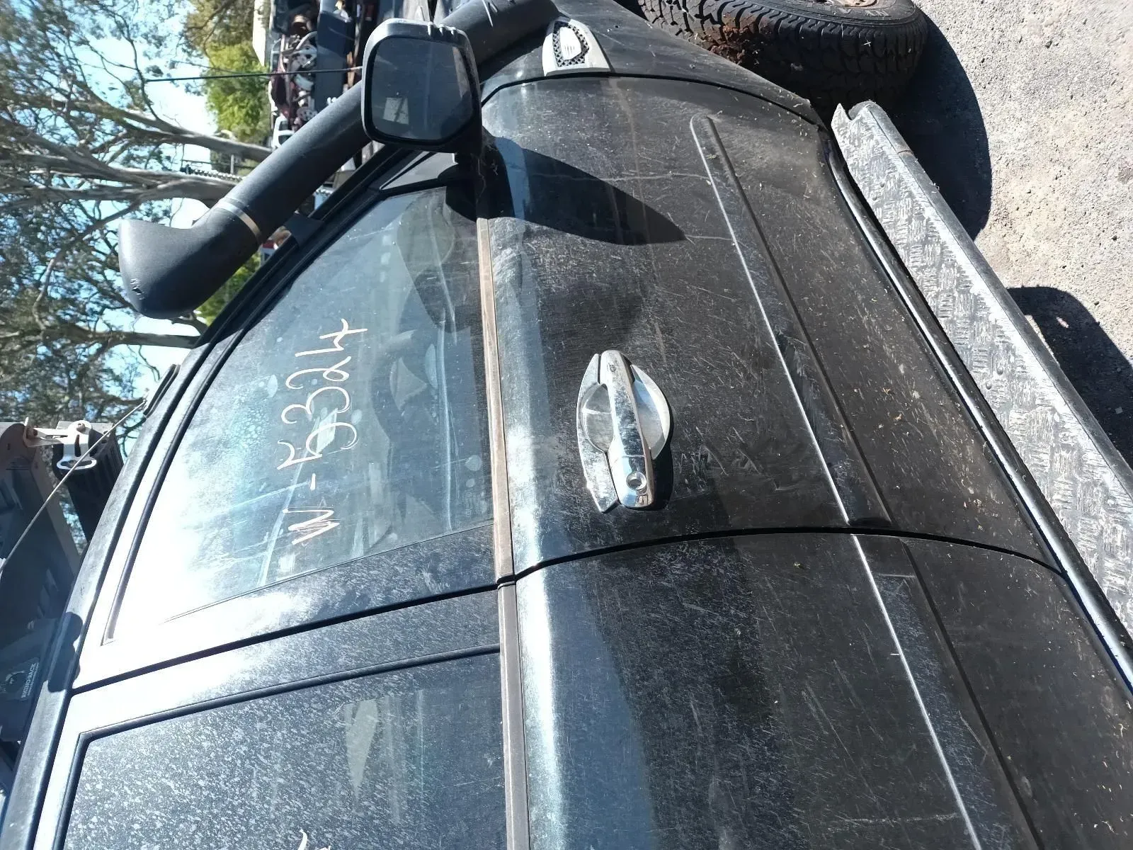 Black Suv Side With Snorkel, Door Handle, and Writing on the Window — South West 4WD Wreckers In Brisbane, QLD