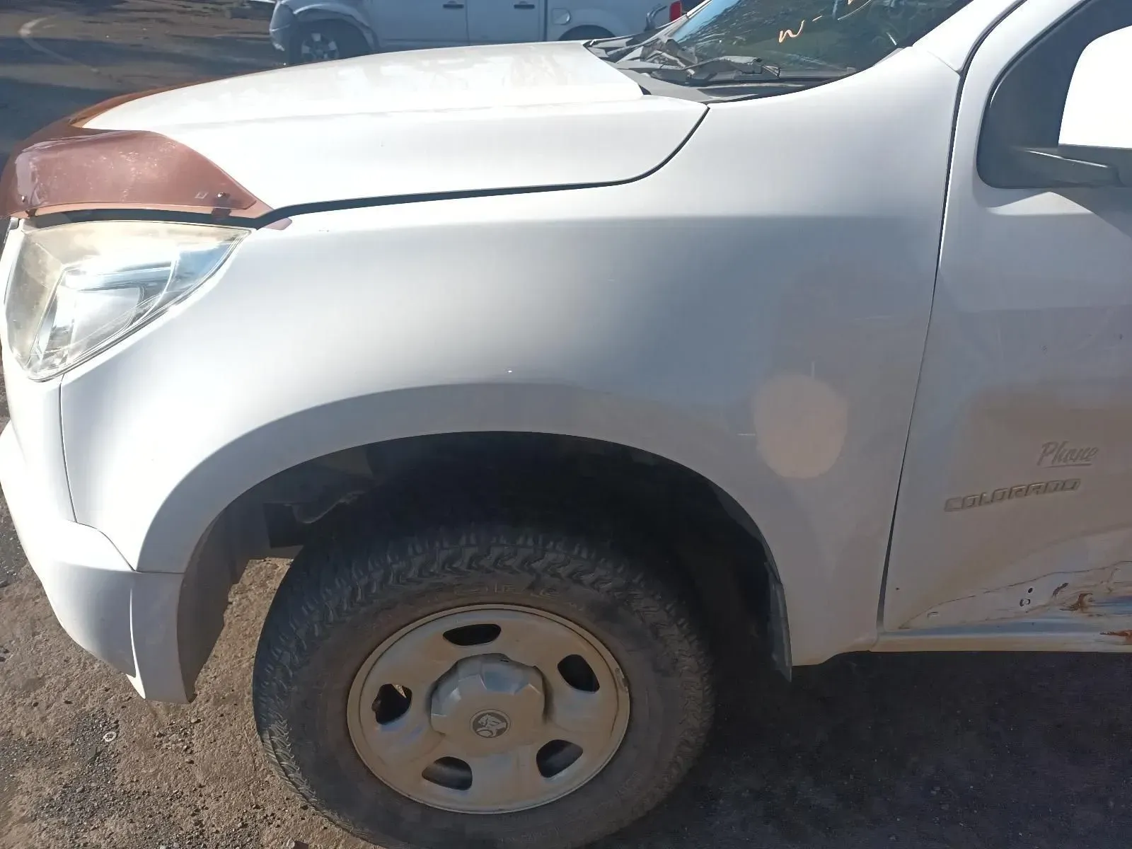 White Truck With a Damaged Front Fender and a Brown Hood Protector — South West 4WD Wreckers In Brisbane, QLD