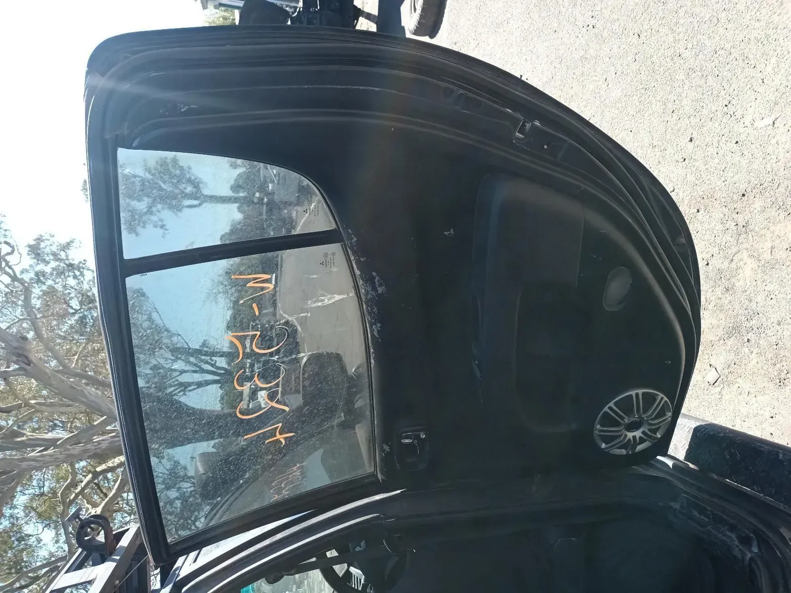 Open Black Car Trunk With Window, Text and Speaker Visible — South West 4WD Wreckers In Brisbane, QLD