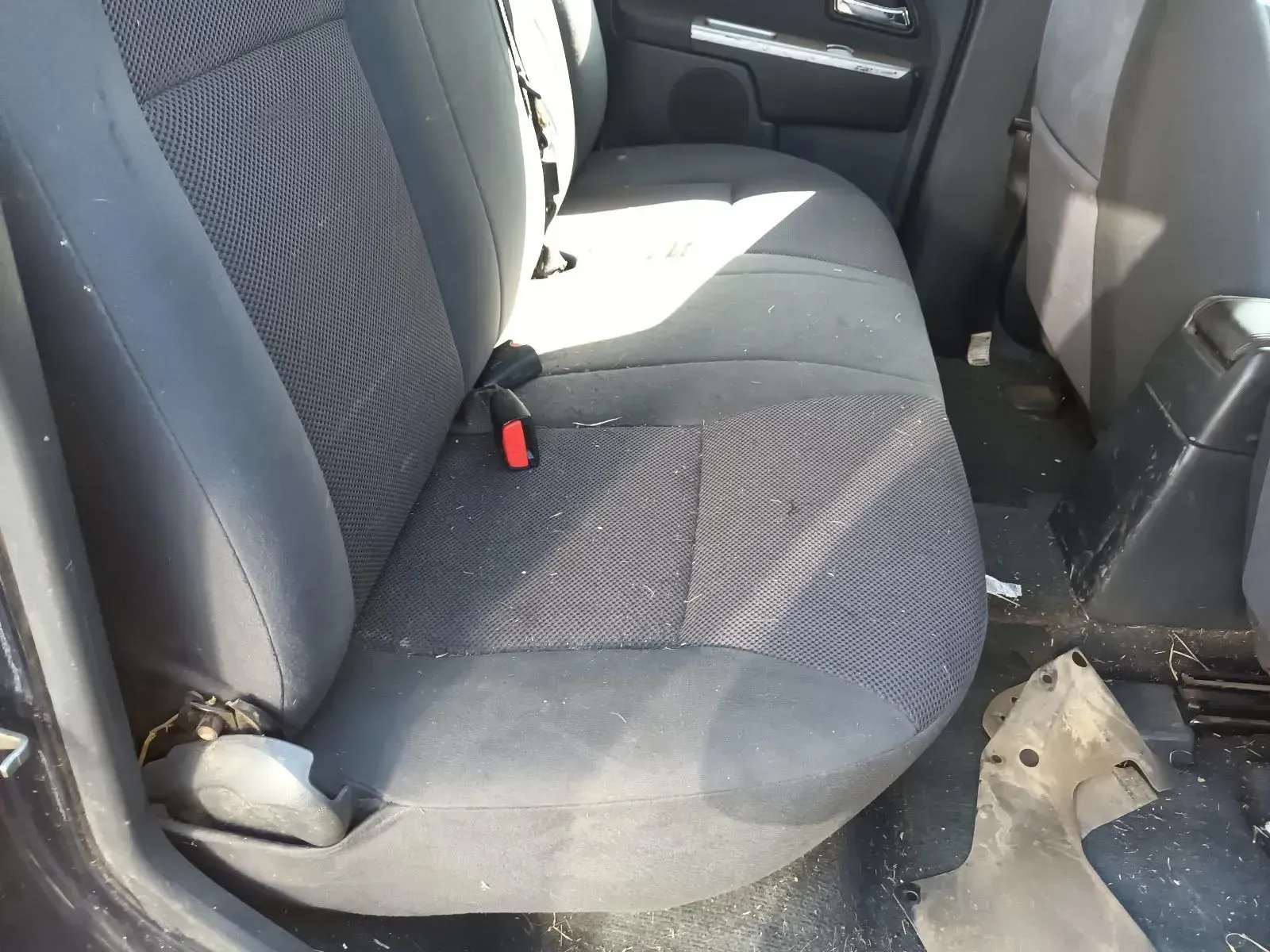 Rear Car Seat, Gray Fabric, Debris on the Seat, Seat Belt Buckled — South West 4WD Wreckers In Brisbane, QLD