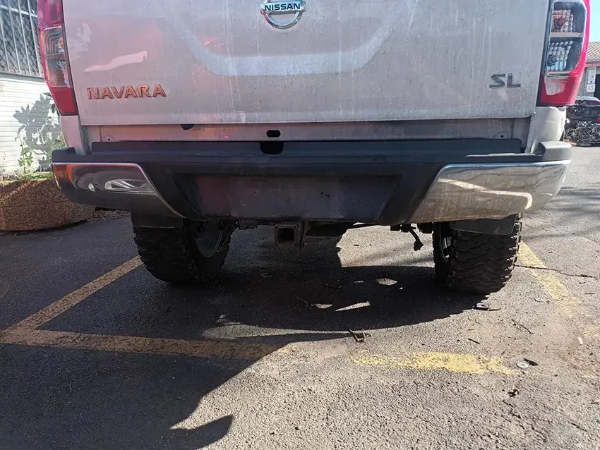 The Back End of a Nissan Navara Truck is Parked in a Parking Lot — South West 4WD Wreckers In Brisbane, QLD