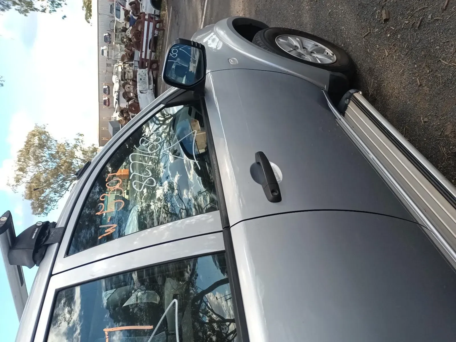Silver Suv Parked Outdoors With a Roof Rack, Side Mirror, and Running Board — South West 4WD Wreckers In Brisbane, QLD