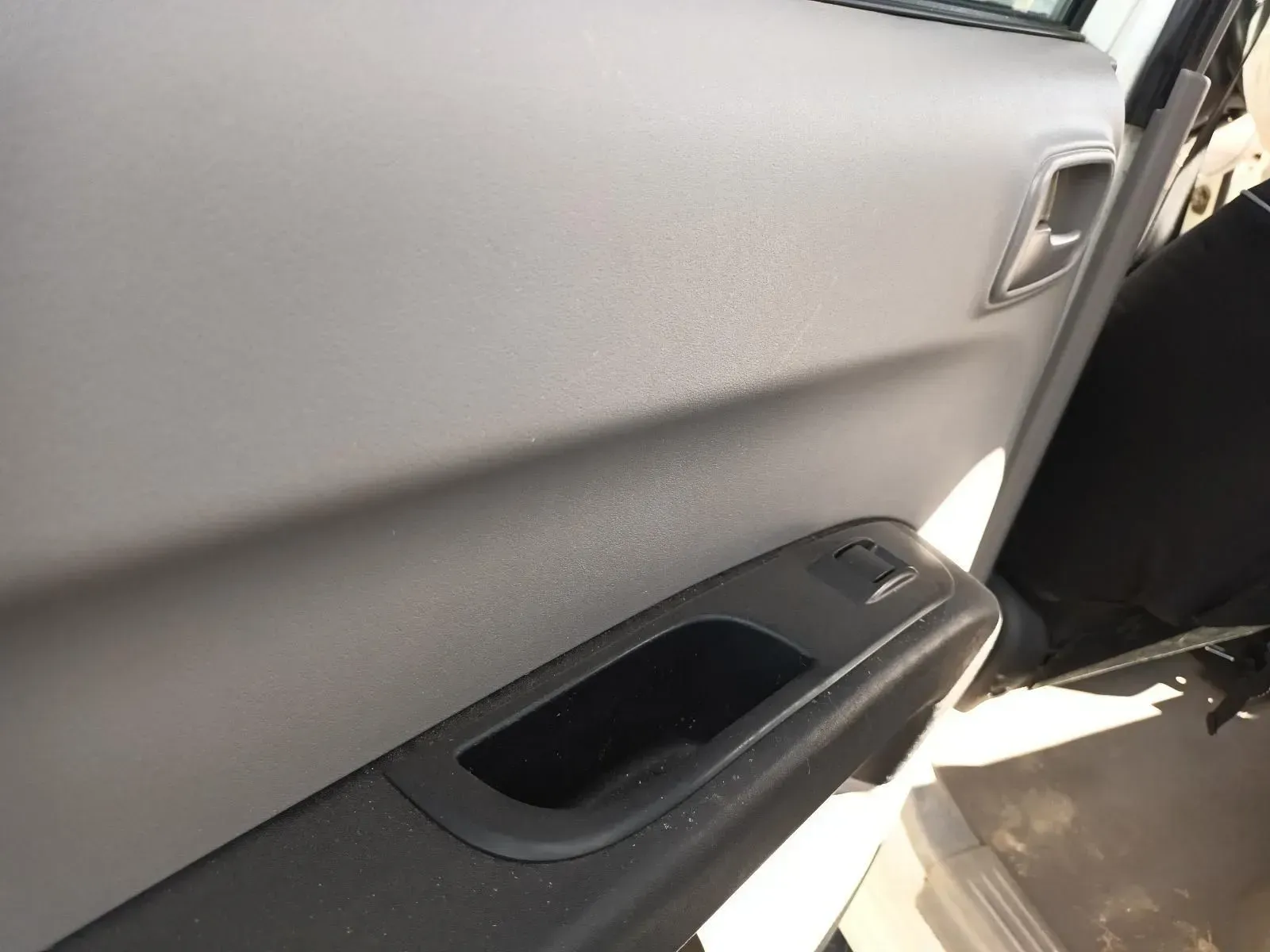 Gray Car Door Panel With Black Handle and Window Controls — South West 4WD Wreckers In Brisbane, QLD
