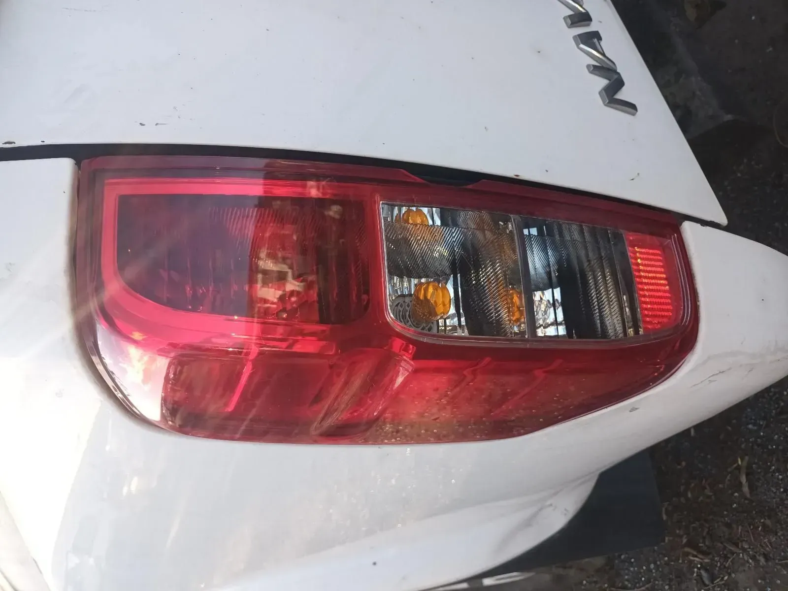 A White Car's Taillight is Red With an Orange Turn Signal — South West 4WD Wreckers In Brisbane, QLD