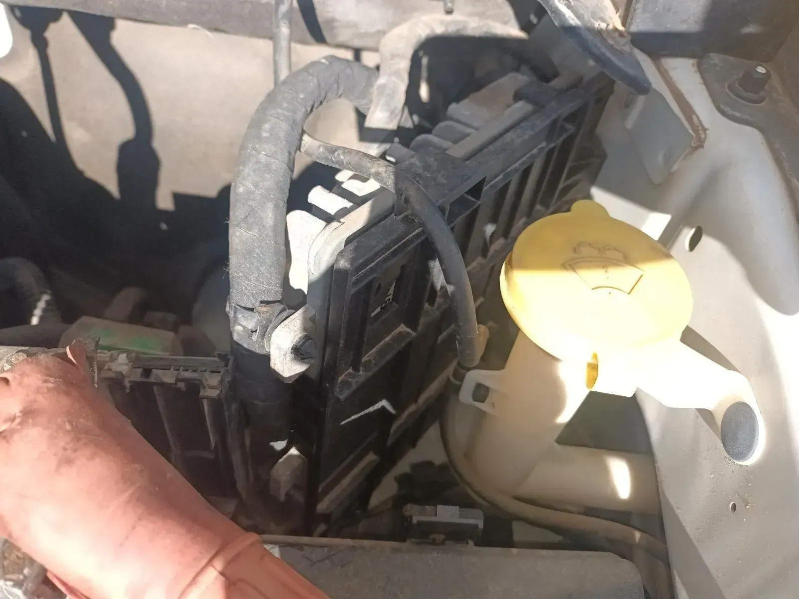 Engine Bay With Black Electrical Box, Hose, Yellow Cap, and White Container — South West 4WD Wreckers In Brisbane, QLD