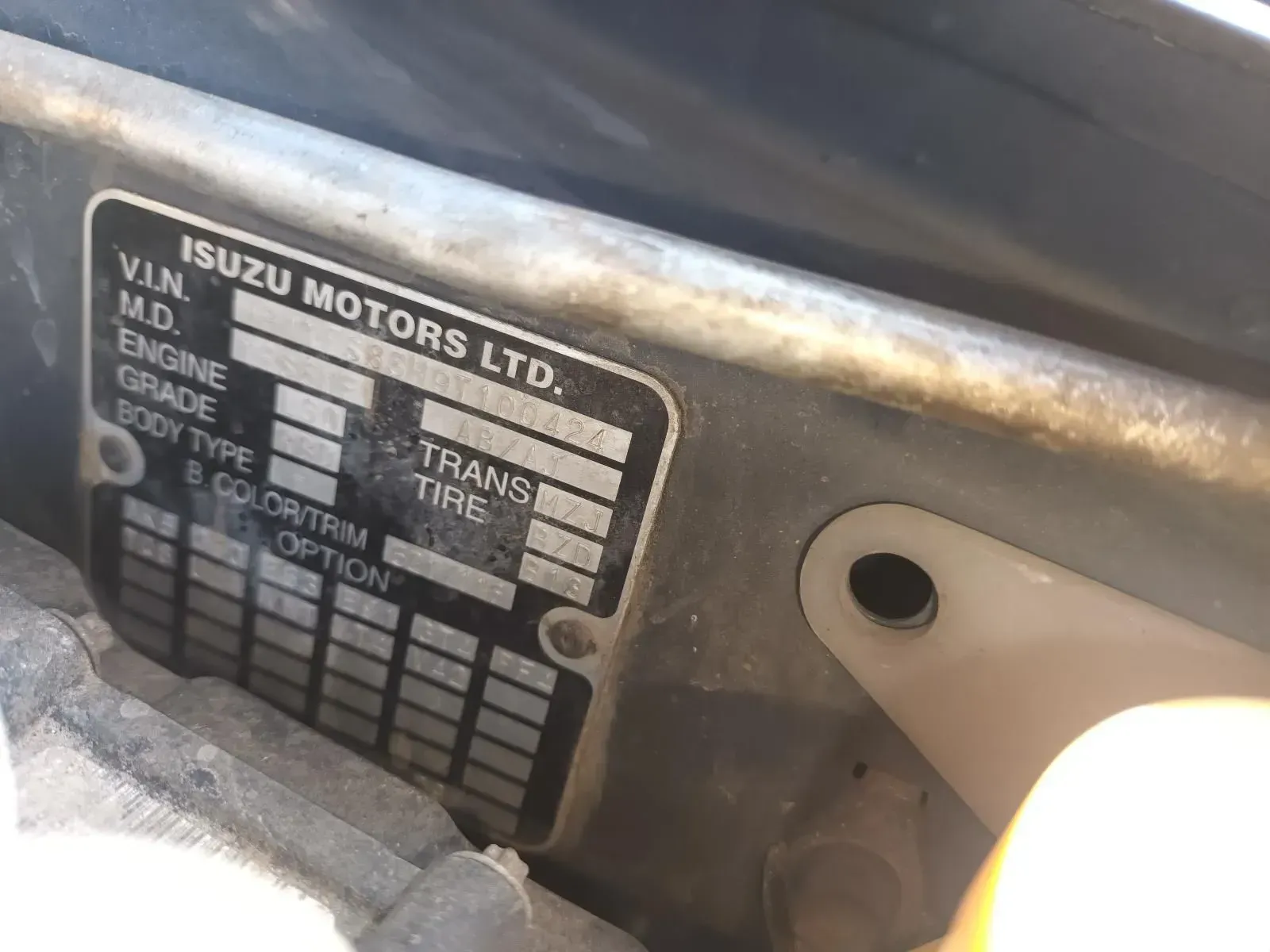 Isuzu Motors Ltd Vehicle Identification Plate With Partially Visible Data — South West 4WD Wreckers In Brisbane, QLD