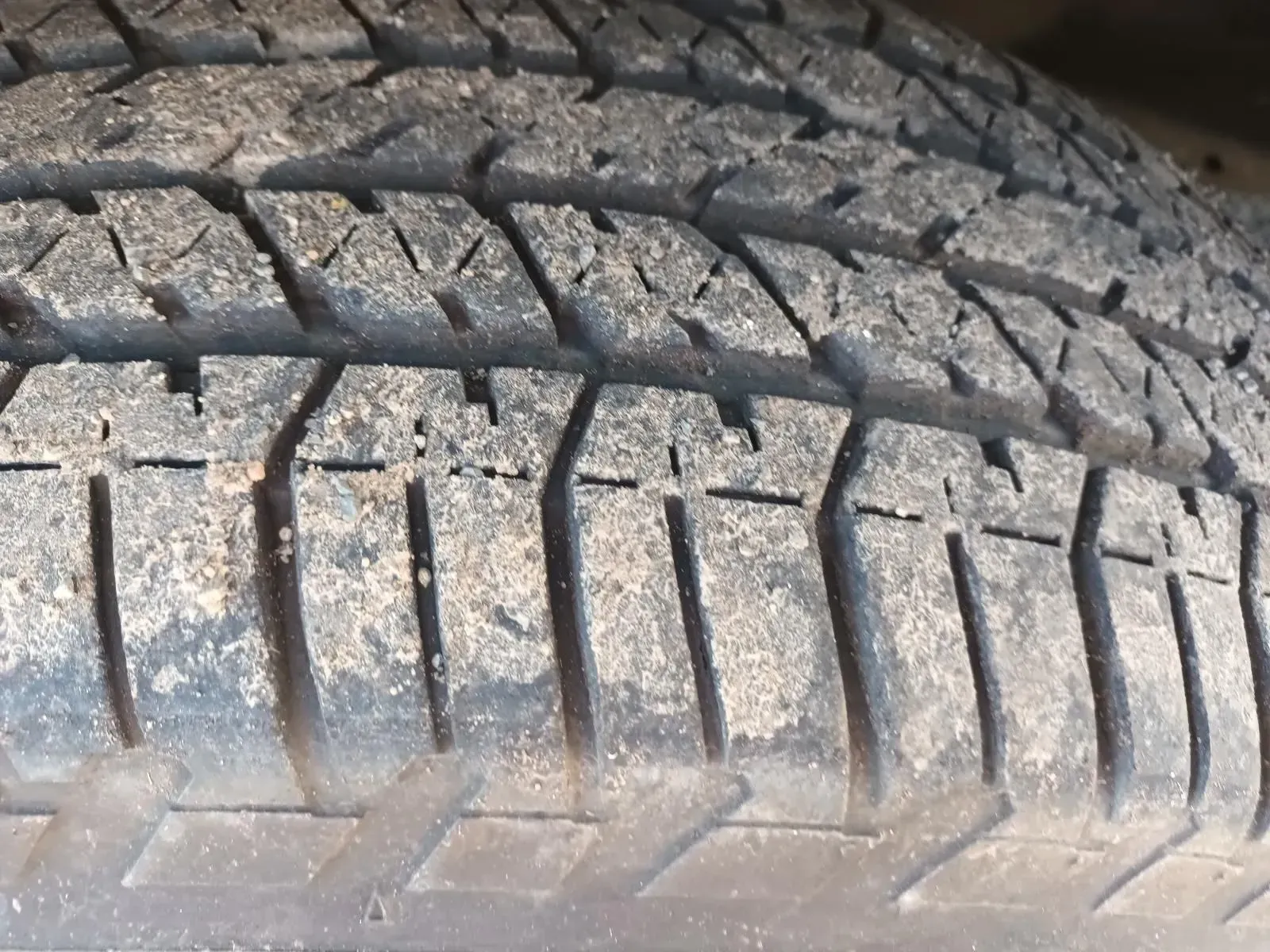 Close-up of a Car Tyre Tread Covered in Sand — South West 4WD Wreckers In Brisbane, QLD