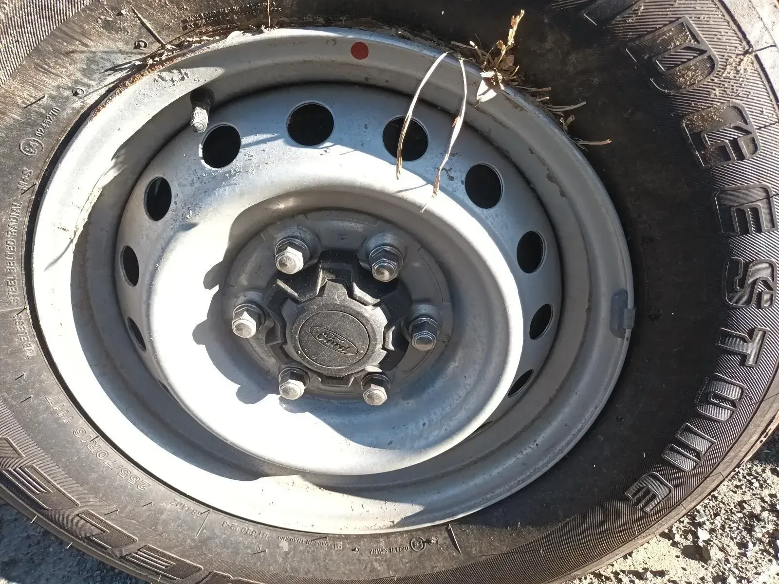 A Close-up of a Car Tyre and Wheel With a Central Hubcap — South West 4WD Wreckers In Brisbane, QLD