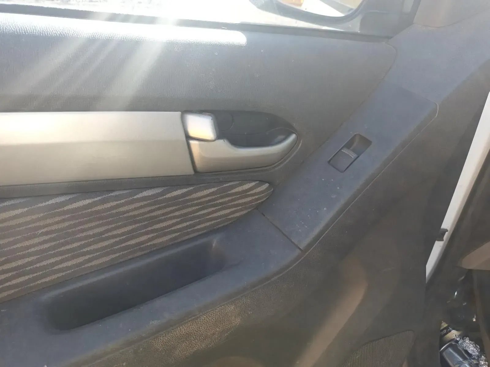 Car Door Interior With Handle, Window Controls, and Patterned Fabric — South West 4WD Wreckers In Brisbane, QLD