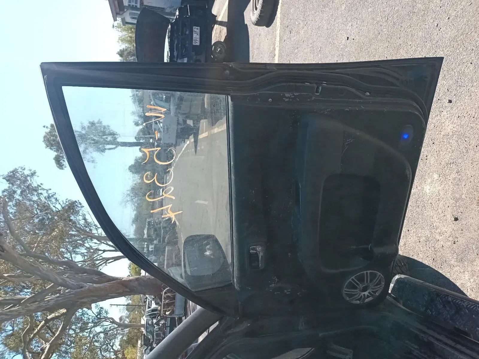 Black Car Door With Window Open, Writing on Window — South West 4WD Wreckers In Brisbane, QLD