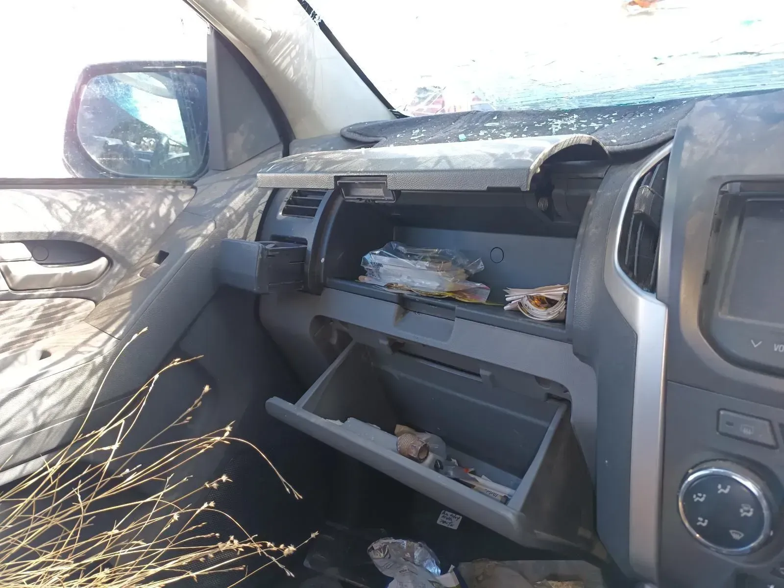 Dashboard of a Car With the Glove Box Open and Debris Inside — South West 4WD Wreckers In Brisbane, QLD