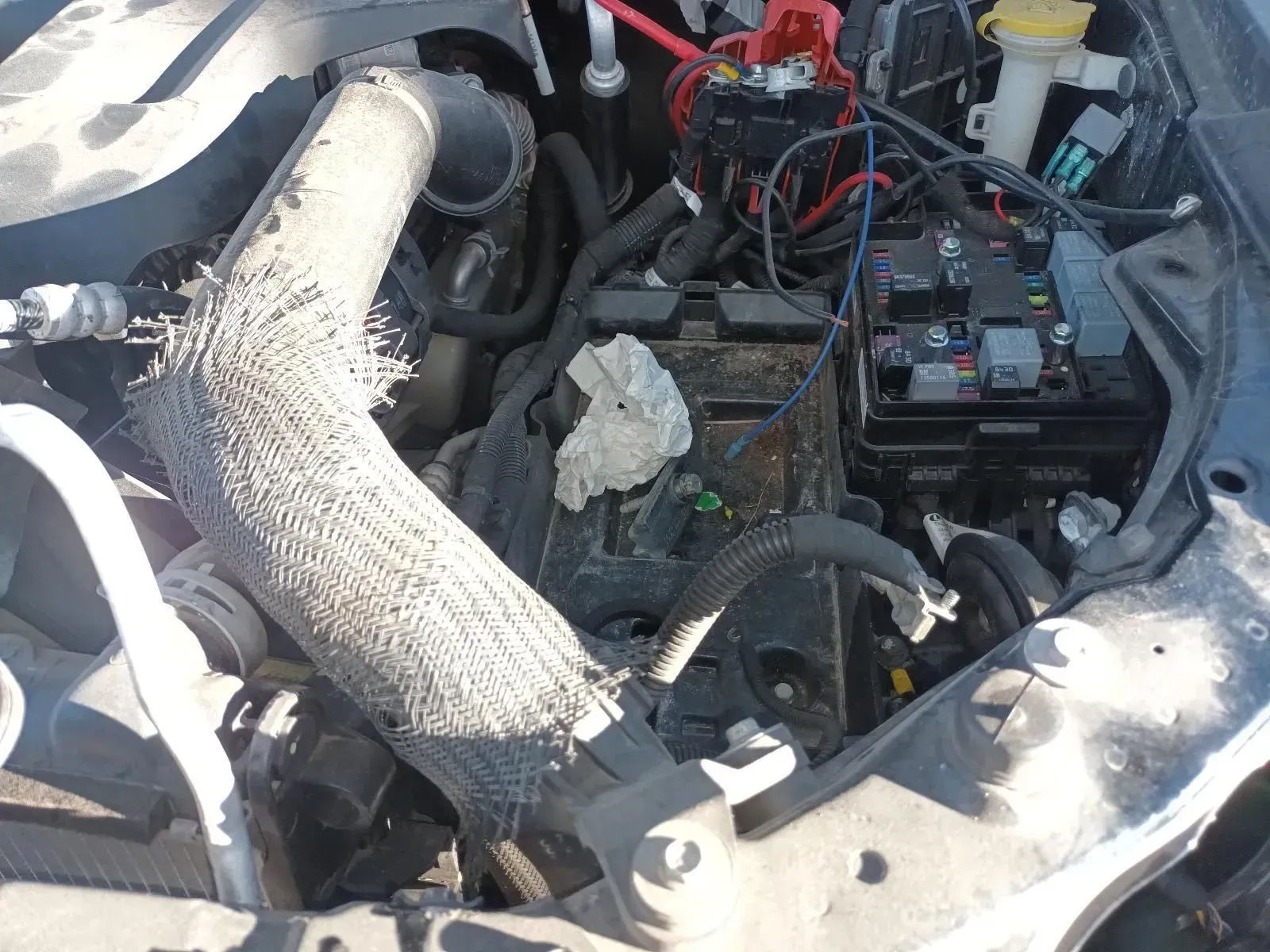 Engine Compartment With Damaged Insulation, Wiring, and Battery — South West 4WD Wreckers In Brisbane, QLD