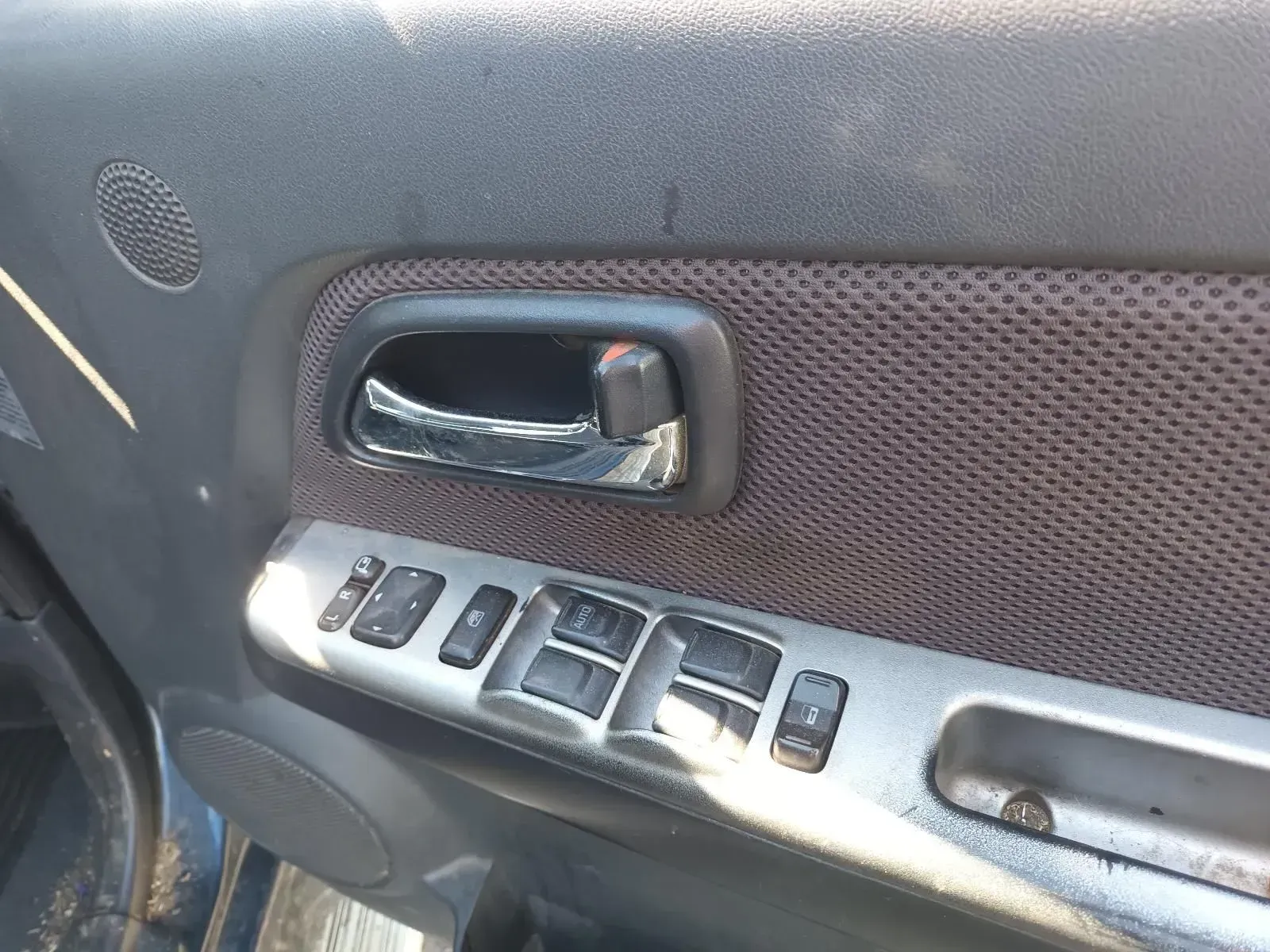 Car Door Interior With Door Handle, Window Controls, and Speaker — South West 4WD Wreckers In Brisbane, QLD