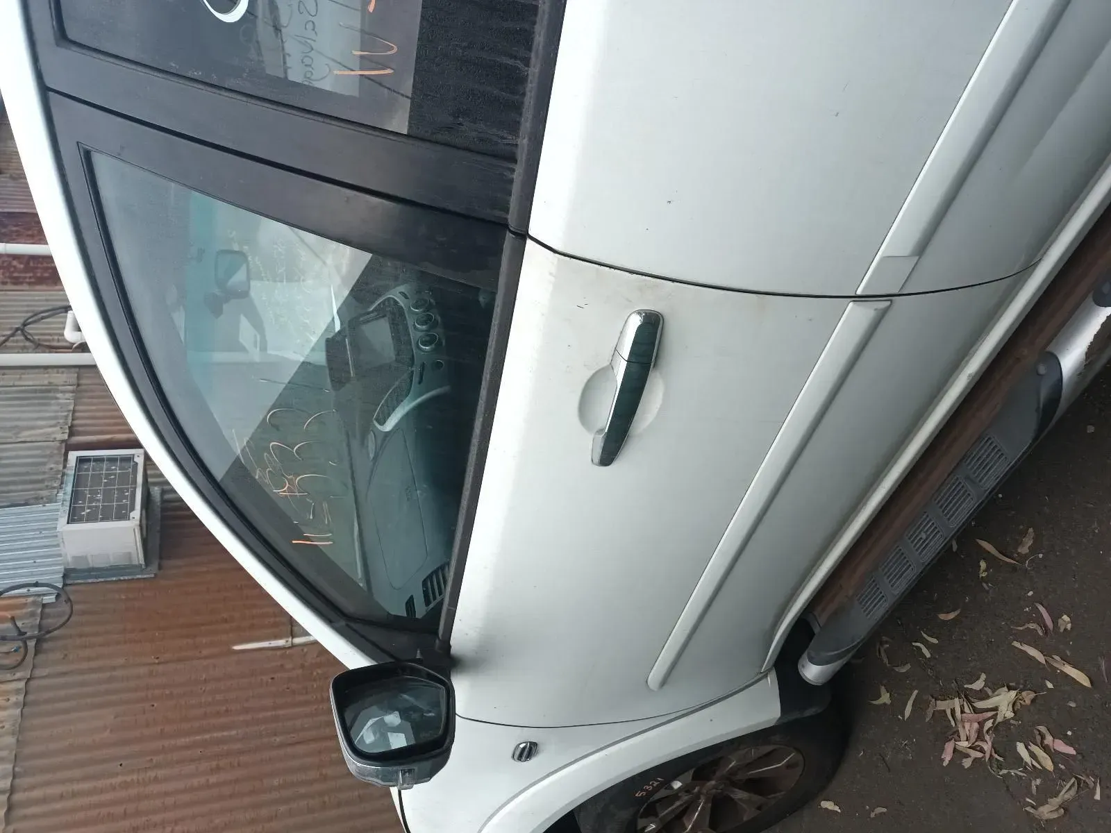 White Suv Parked, Side View Showing Door, Window, and Side Mirror — South West 4WD Wreckers In Brisbane, QLD