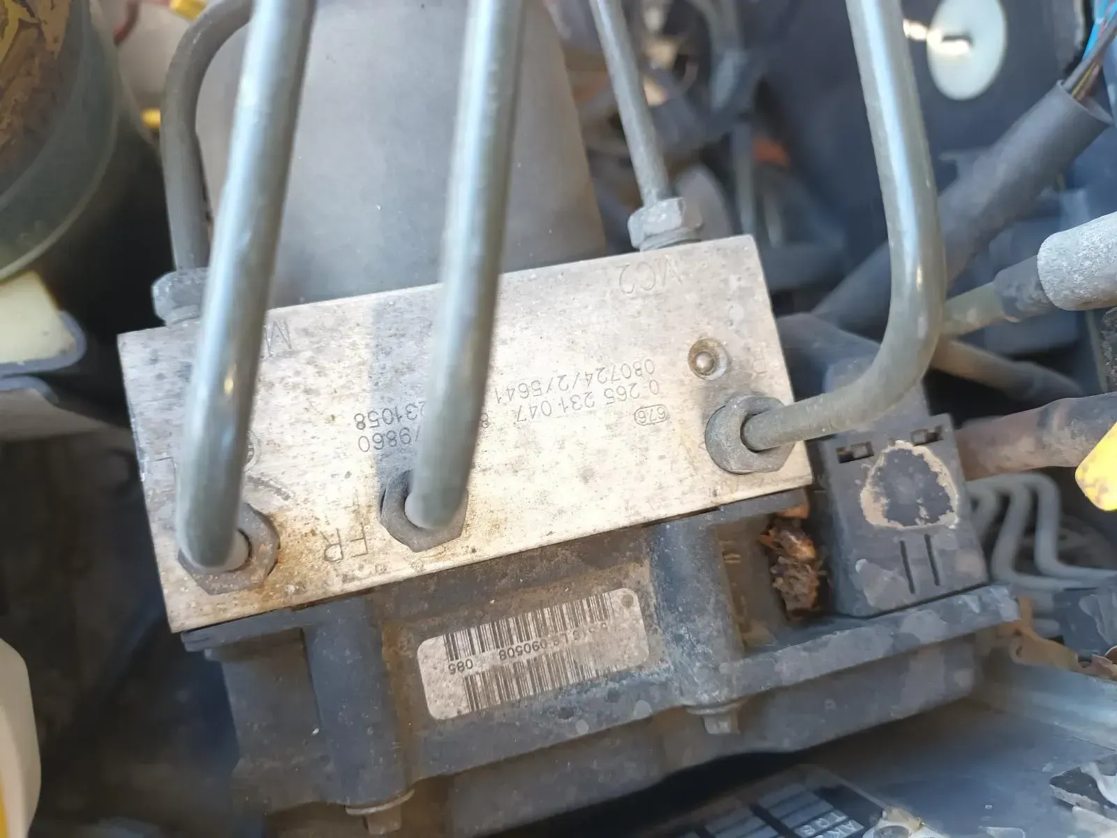 A Close-up of a Car's Abs Module With Brake Lines Attached — South West 4WD Wreckers In Brisbane, QLD