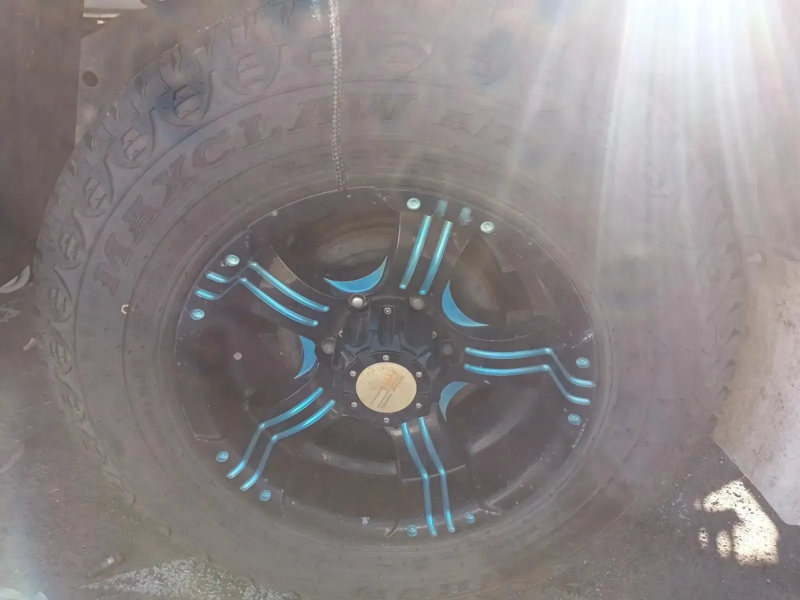 Black Tyre With Custom Black Rim Featuring Blue Accents — South West 4WD Wreckers In Brisbane, QLD