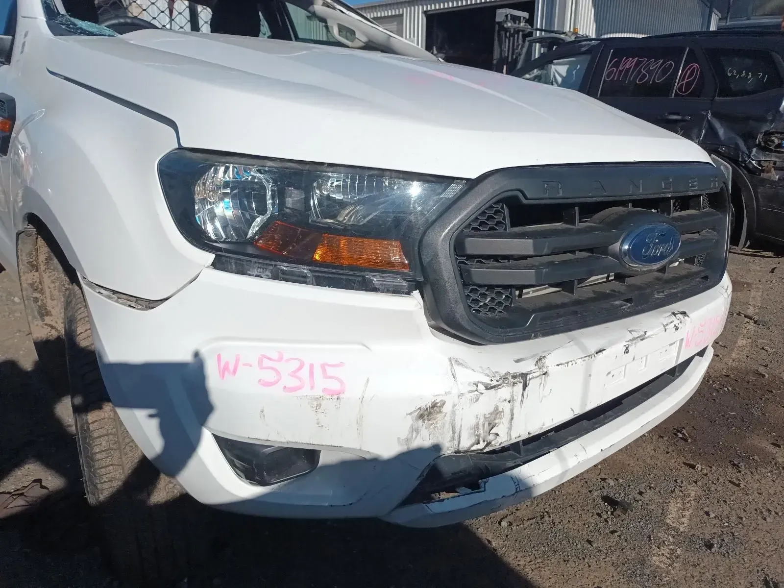White Ford Ranger Truck With Front-end Damage, in a Junkyard — South West 4WD Wreckers In Brisbane, QLD