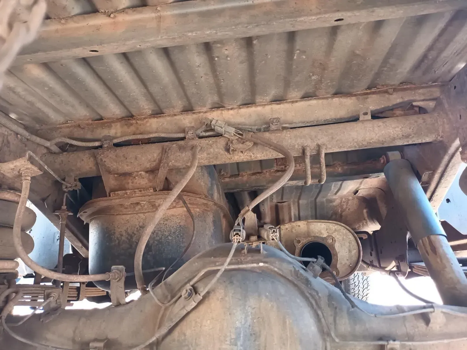 Undercarriage of a Truck, Showing the Axle, Exhaust, Suspension, and Air Bags — South West 4WD Wreckers In Brisbane, QLD
