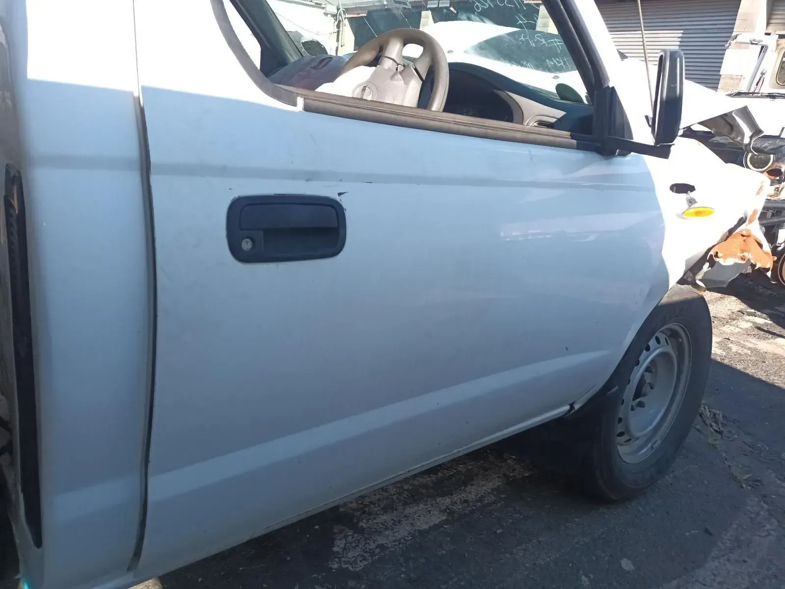 White Truck Door With Black Handle, Side View, Outdoors — South West 4WD Wreckers In Brisbane, QLD