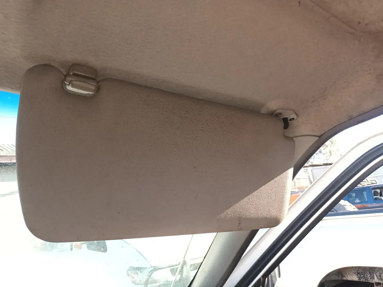 Tan Car Sun Visor in the Down Position, Attached to the Interior Roof — South West 4WD Wreckers In Brisbane, QLD