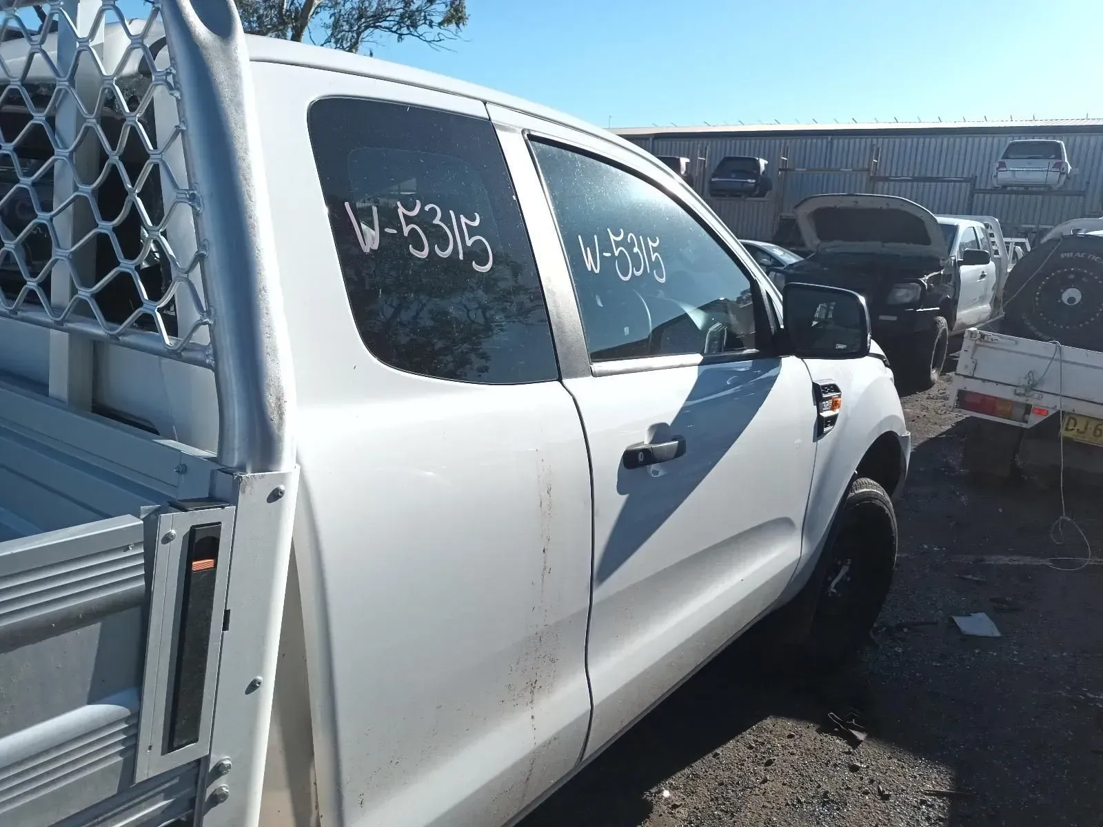 White Ford Ranger Pickup Truck in a Salvage Yard — South West 4WD Wreckers In Brisbane, QLD