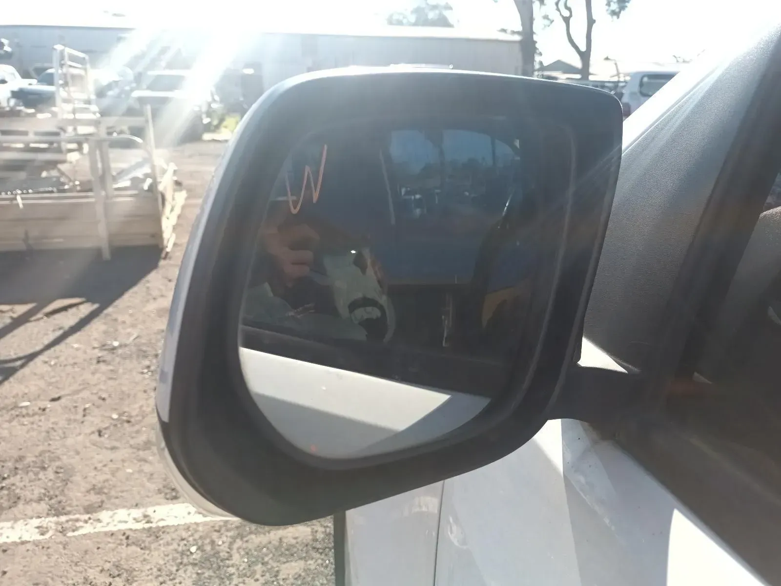 Side View Mirror Reflecting a Vehicle Interior and Exterior — South West 4WD Wreckers In Brisbane, QLD