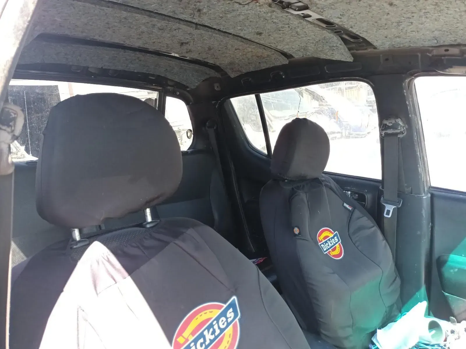 Interior View of a Black Truck Cab With Dickies Seat Covers — South West 4WD Wreckers In Brisbane, QLD