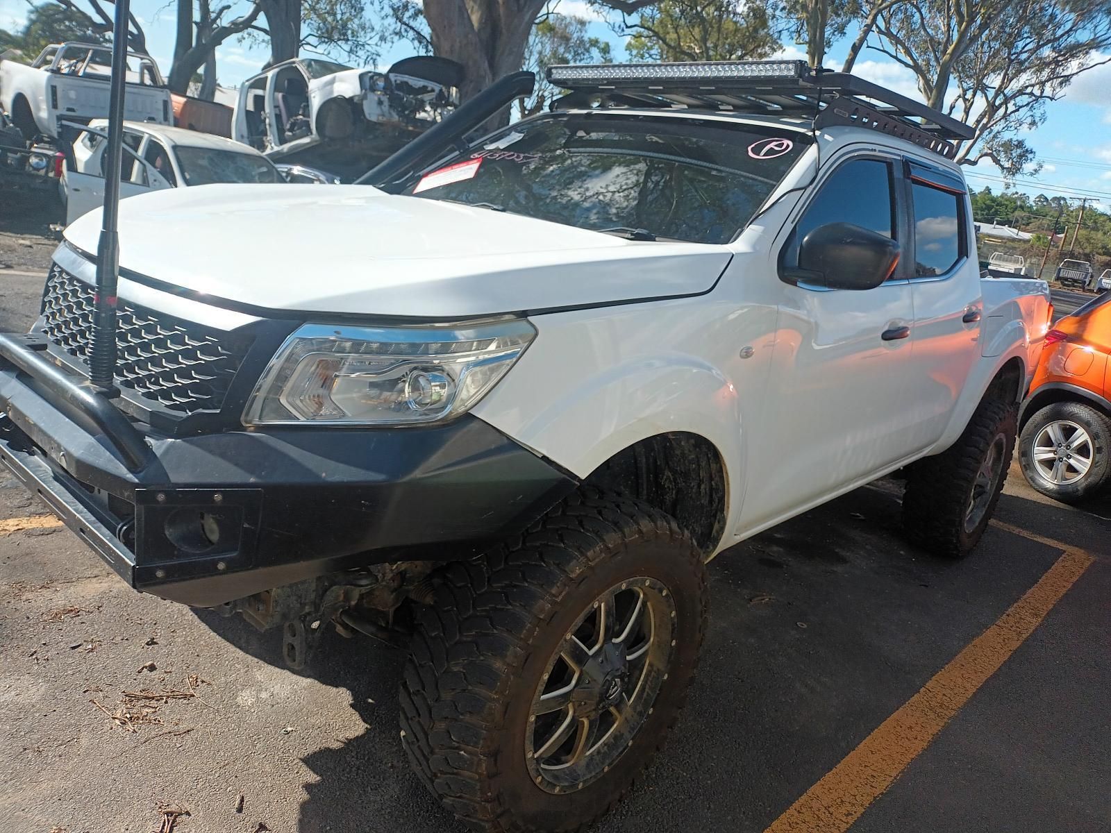 A White Pickup Truck is Parked in a Parking Lot — South West 4WD Wreckers In Brisbane, QLD
