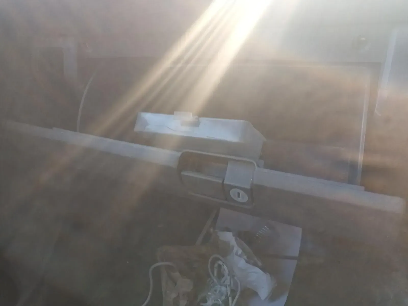 Dusty, Low-angle View of a Horizontal Gate Arm, Likely for a Driveway — South West 4WD Wreckers In Brisbane, QLD