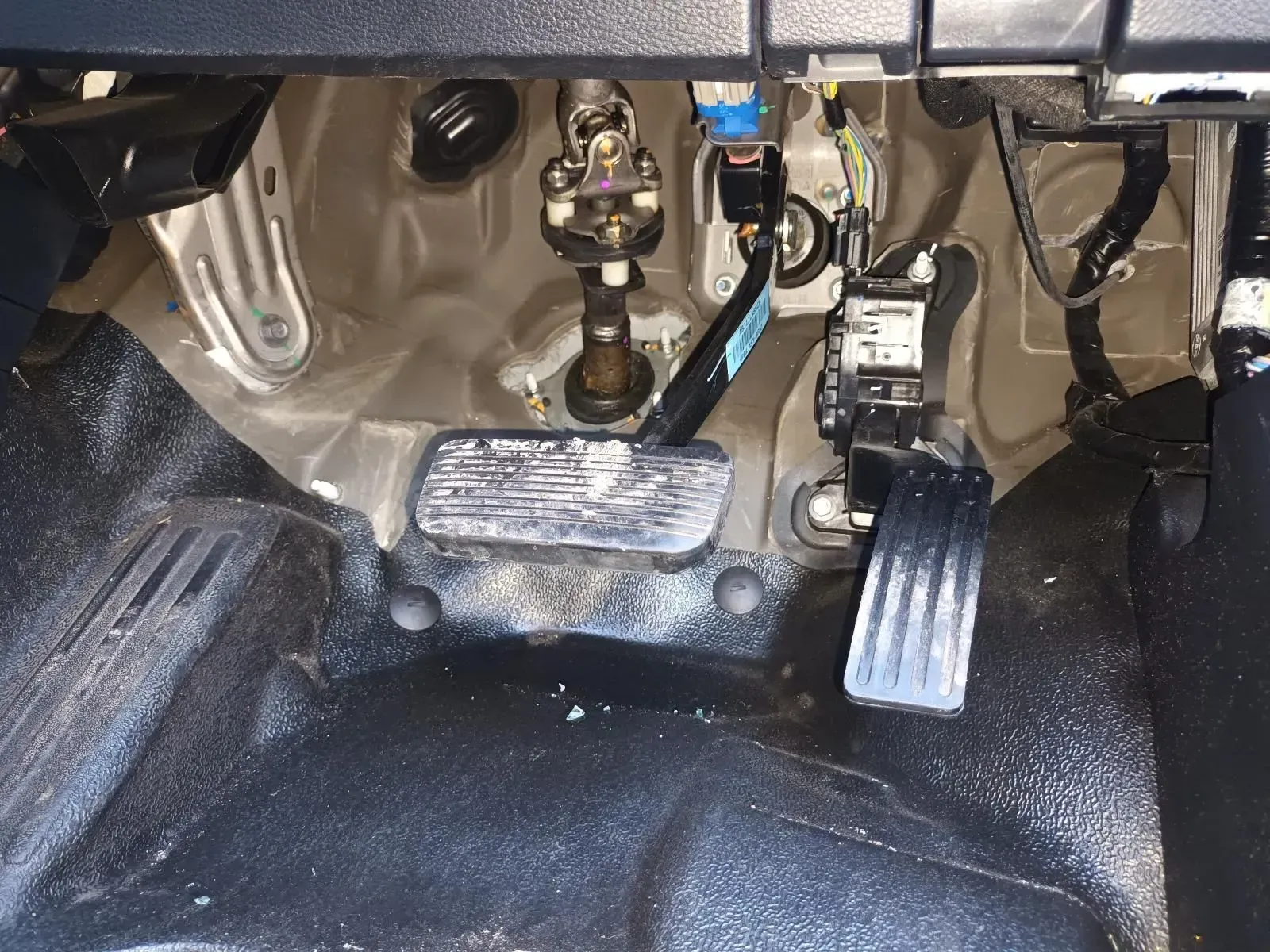 Interior View of a Car Footwell With Gas and Brake Pedals, Steering Column — South West 4WD Wreckers In Brisbane, QLD