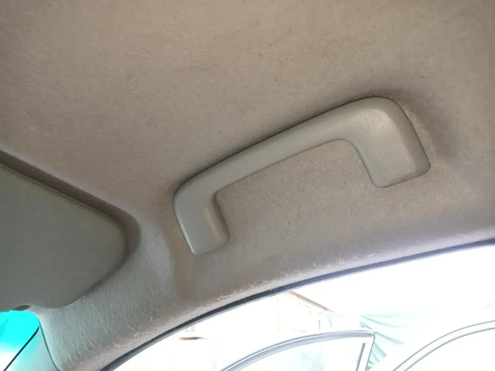 Gray Interior Car Grab Handle on a Beige Headliner, Above the Window — South West 4WD Wreckers In Brisbane, QLD