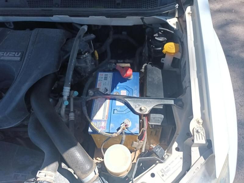 The Hood of a White Car With a Blue Battery in It — South West 4WD Wreckers In Brisbane, QLD