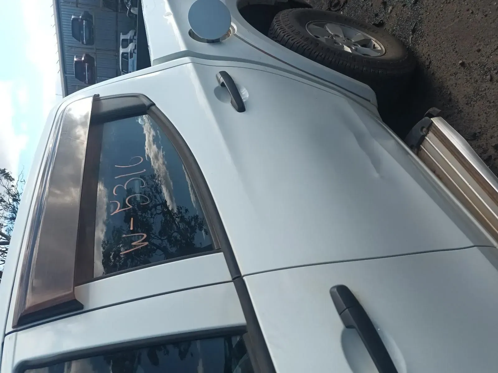 White Pickup Truck, Side View. Shows the Door Handle, Window, and Side Mirror — South West 4WD Wreckers In Brisbane, QLD
