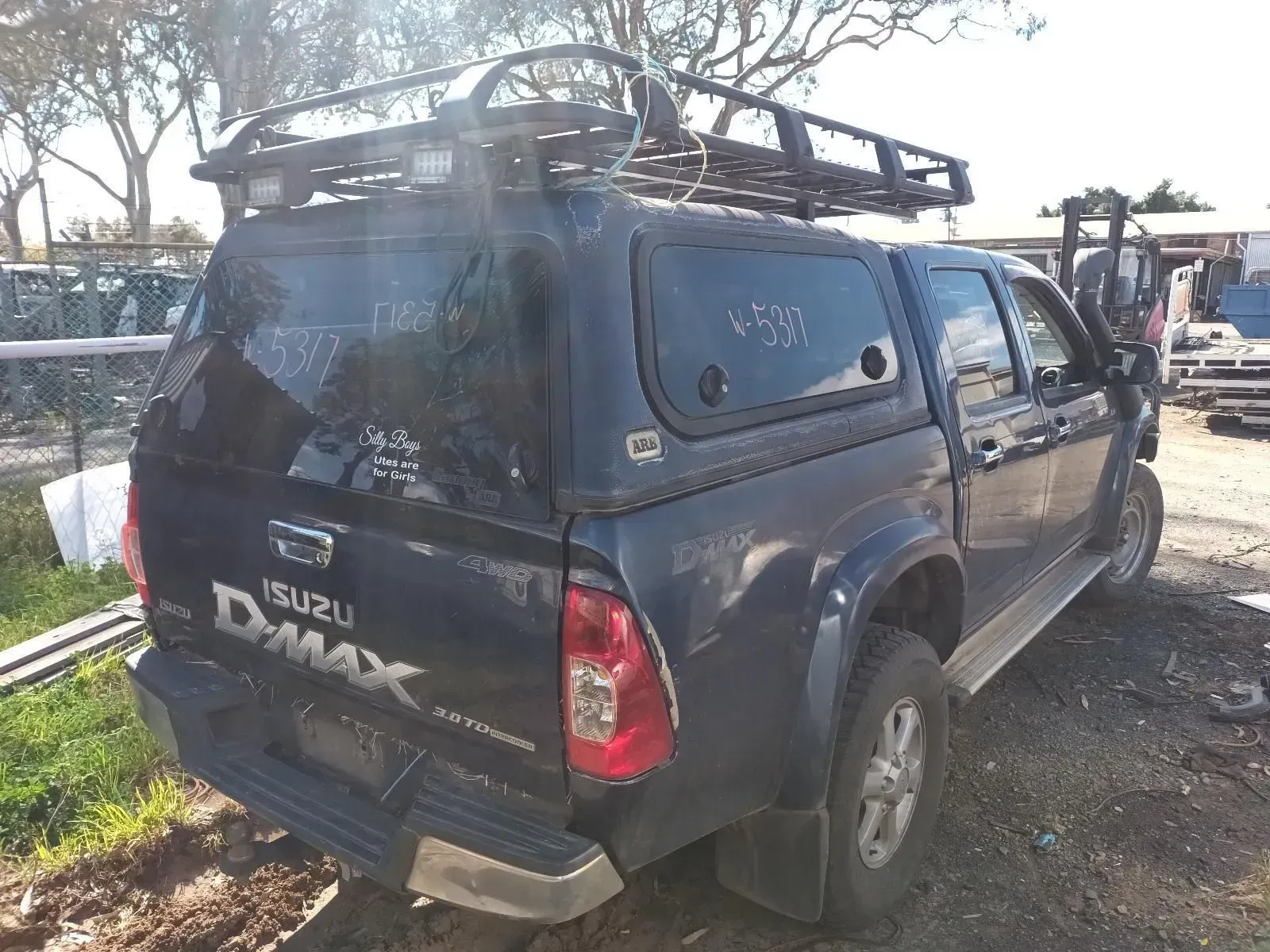 Dark Blue Isuzu D-max Truck With a Canopy and Roof Rack, Parked Outdoors — South West 4WD Wreckers In Brisbane, QLD