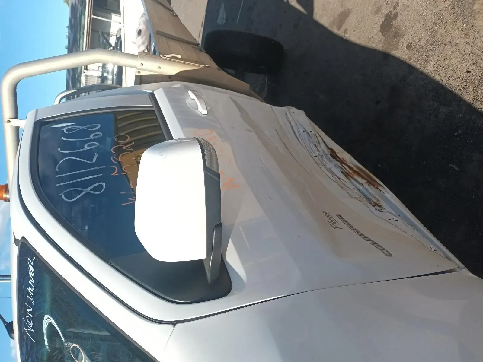 White Pickup Truck With Side Mirror Extended, Parked Outdoors in Daylight — South West 4WD Wreckers In Brisbane, QLD