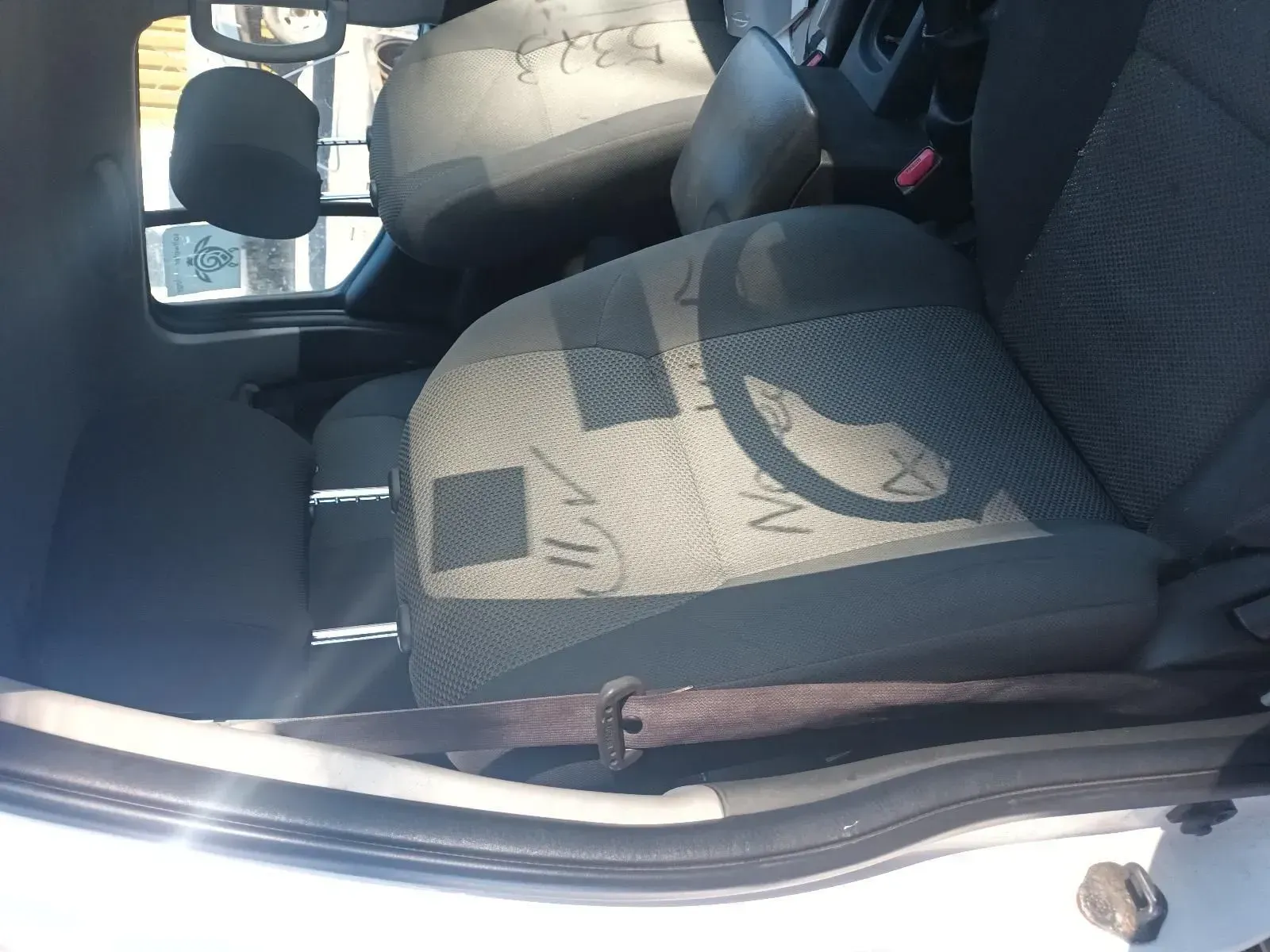 Interior of a White Car; Shows Seats and a Seat Belt Buckle — South West 4WD Wreckers In Brisbane, QLD