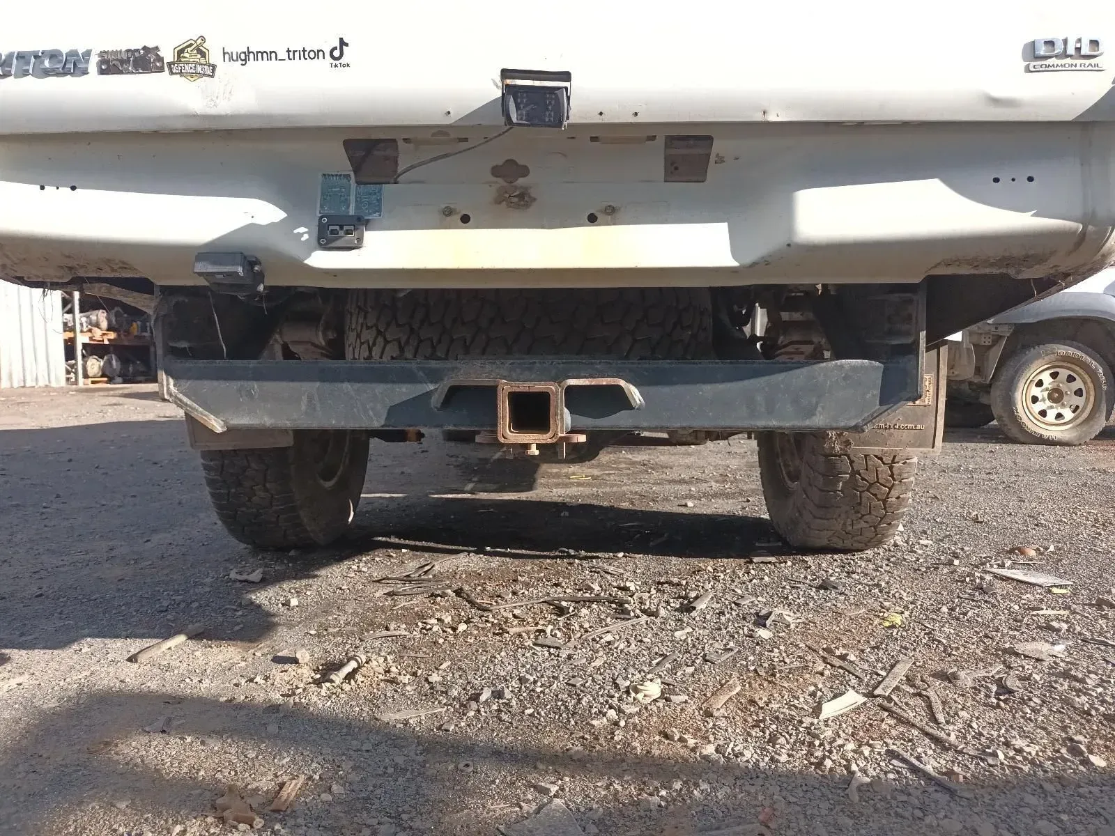 Truck's Rear End With a Black Bumper and Trailer Hitch, Parked on Dirt — South West 4WD Wreckers In Brisbane, QLD