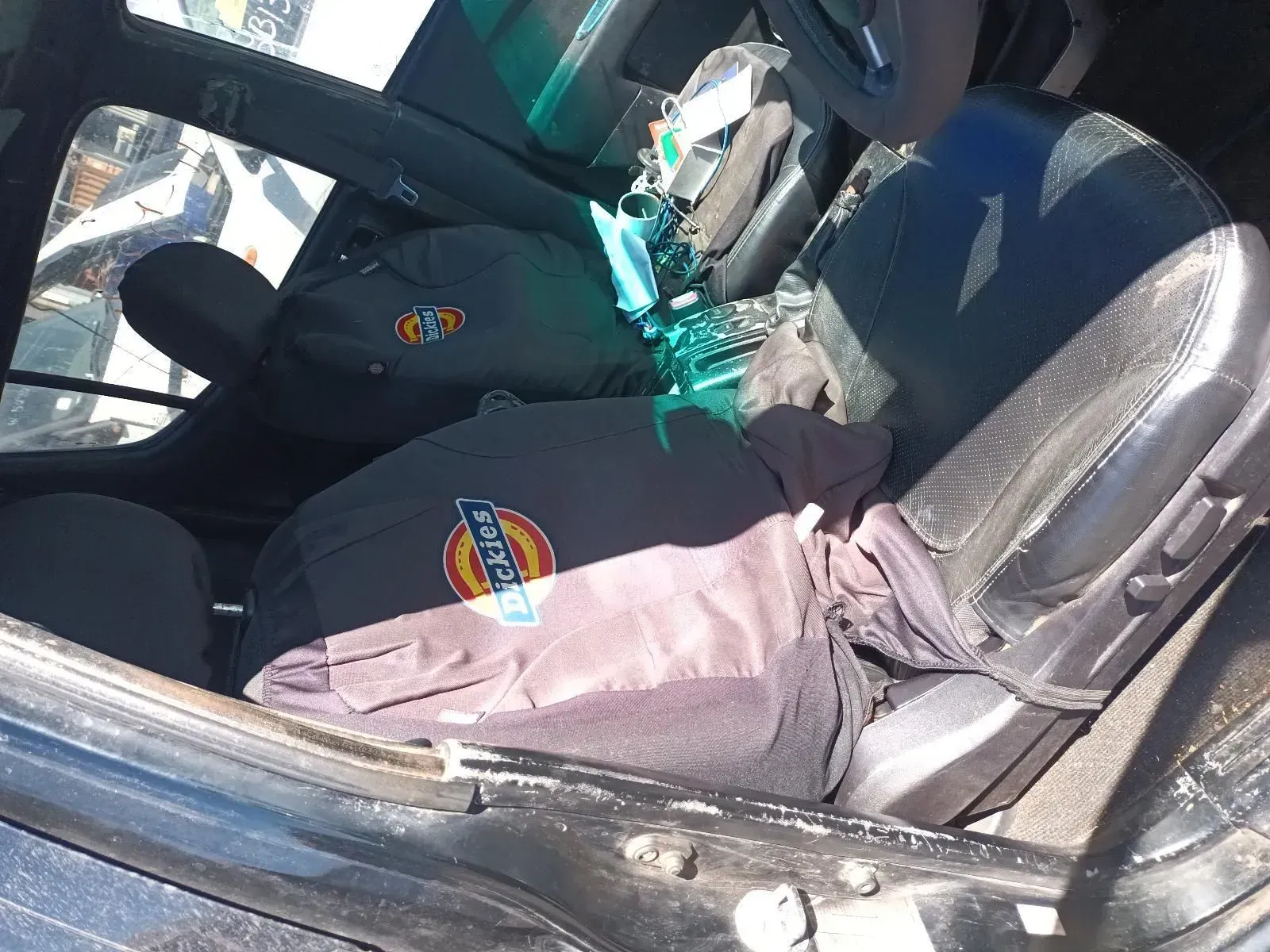 Inside a Wrecked Car, Two Black Bags Are on the Front Passenger Seat — South West 4WD Wreckers In Brisbane, QLD